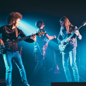 man and woman playing guitars